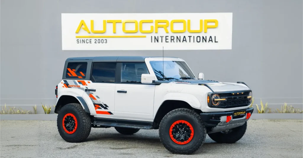 White Ford Bronco Raptor with orange accents