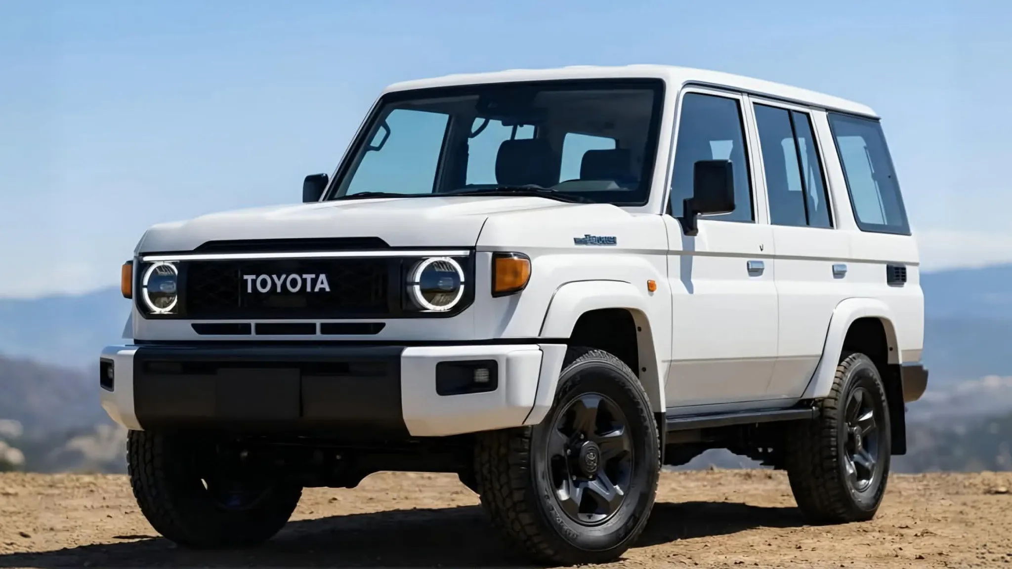 White Toyota Land Cruiser SUV on dirt overlook