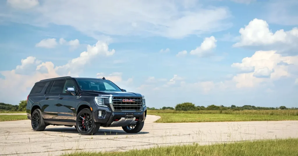 Black GMC SUV parked on open road