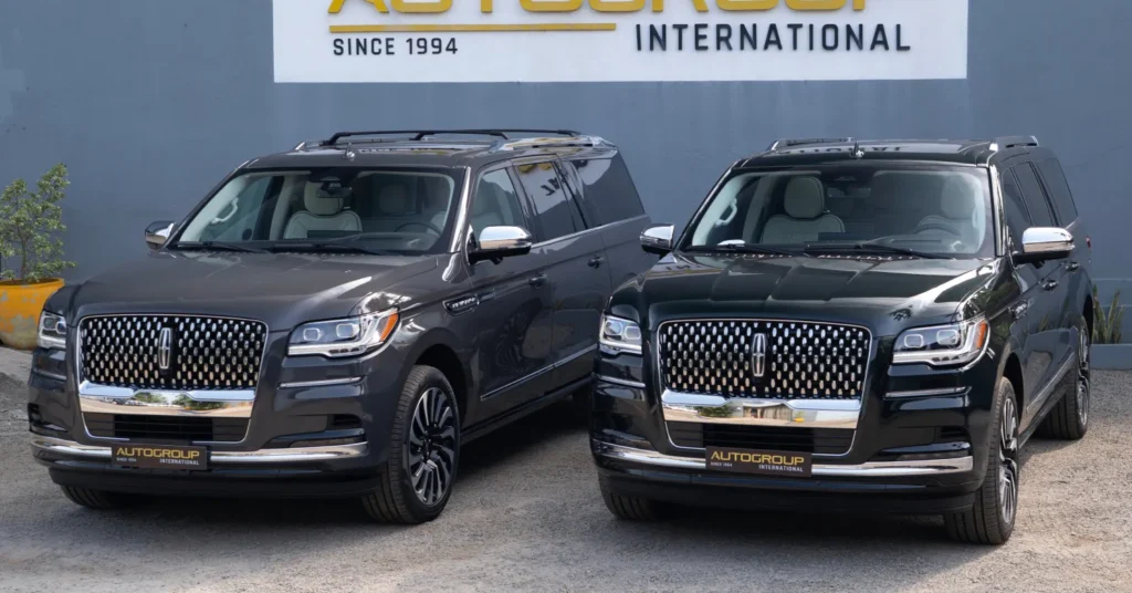 Two Lincoln Navigator SUVs parked side by side