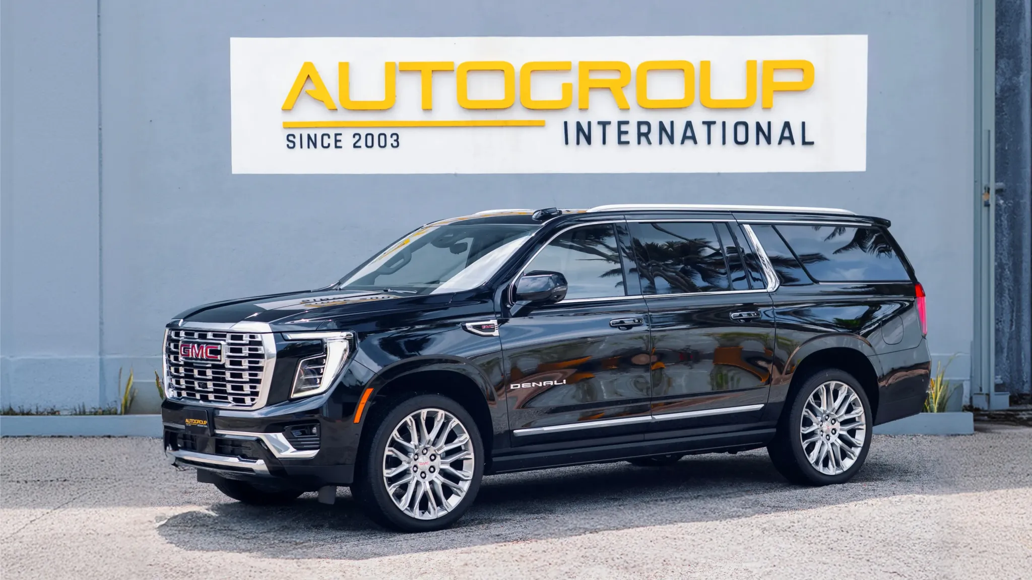 Black GMC Yukon Denali parked outside dealership